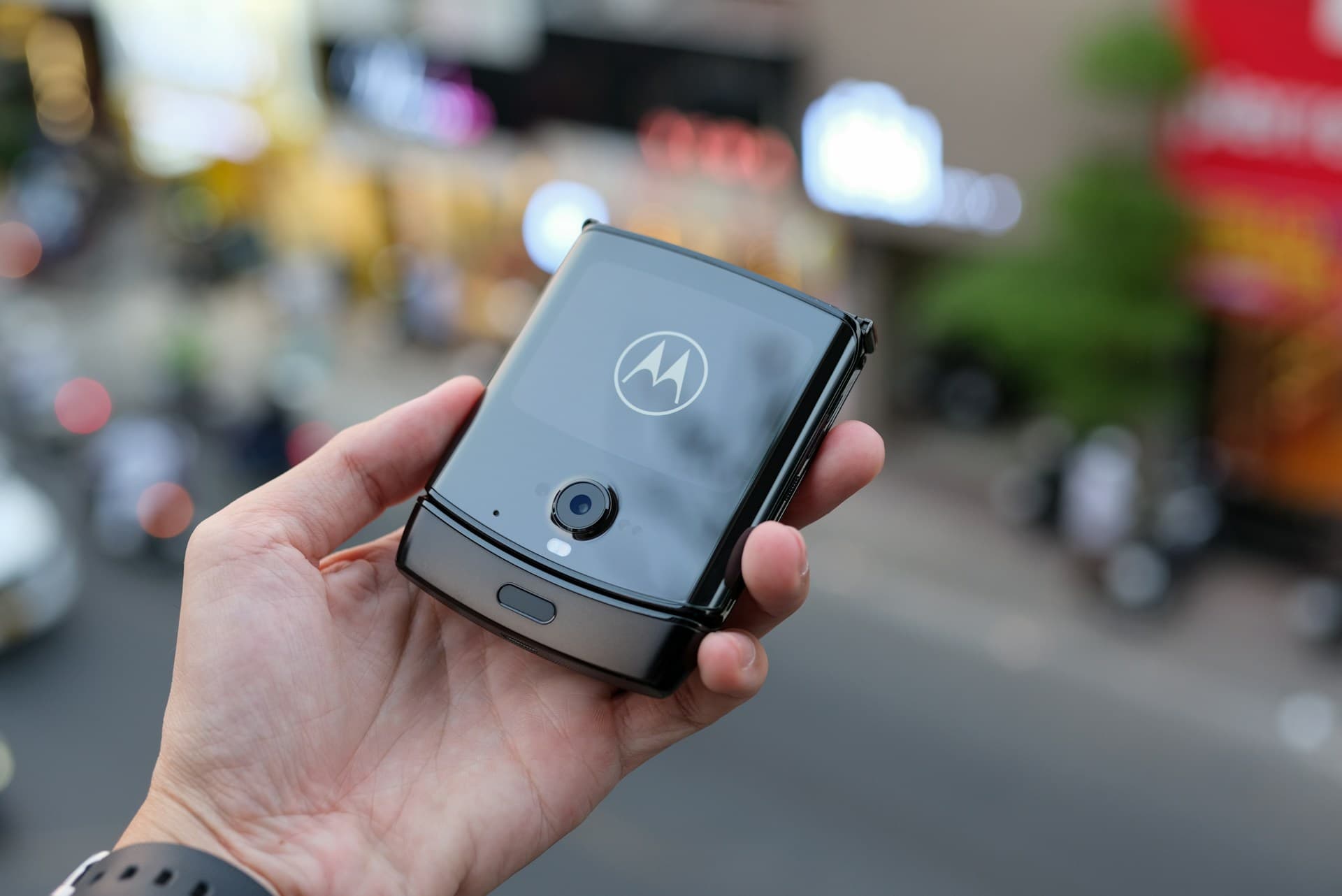 Motorola Razr shown in three positions - fully closed, tent mode, and fully open - with overlay indicators showing Hall Effect sensor locations near the hinge